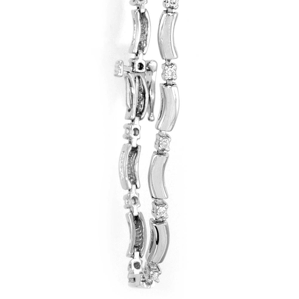 Link Bracelet with prong set round diamond cast in 14K white gold