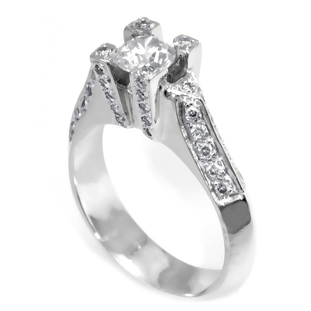 A simple design of an Engagement Ring in 14K White Gold with pave set Round Diamonds