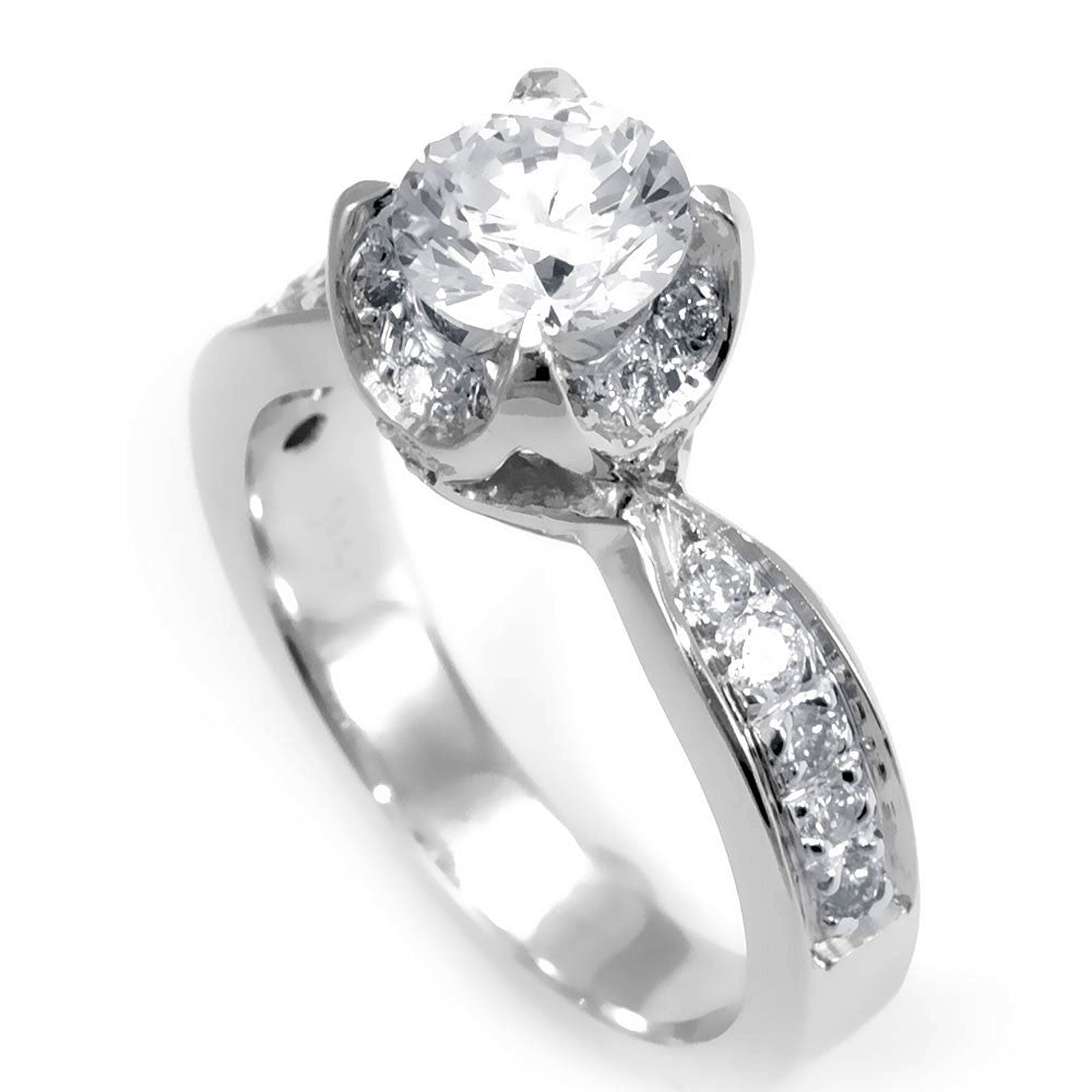 A simple design of an Engagement Ring in 14K White Gold with pave set Round Diamonds