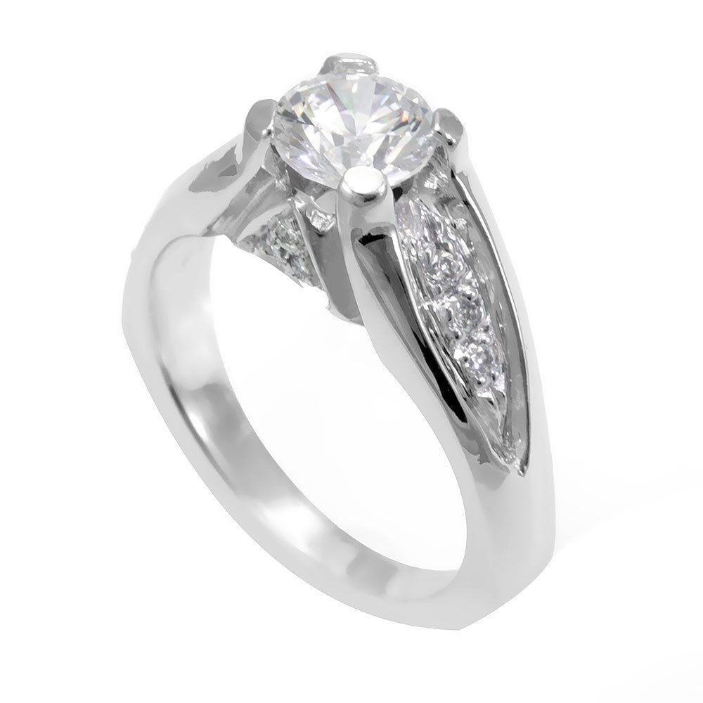 A simple design of an Engagement Ring in 14K White Gold with pave set Round Diamonds